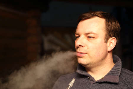 Man smoking shisha in the outdoor cafe