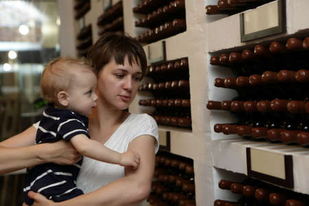 Mother with her son have excursion at winery
