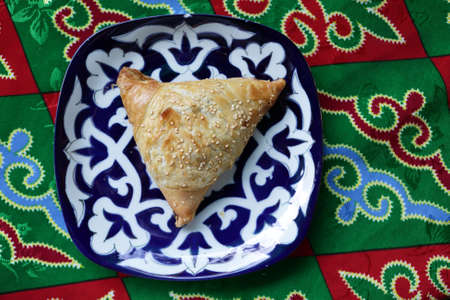 Plate with samsa on a table in uzbek restaurant