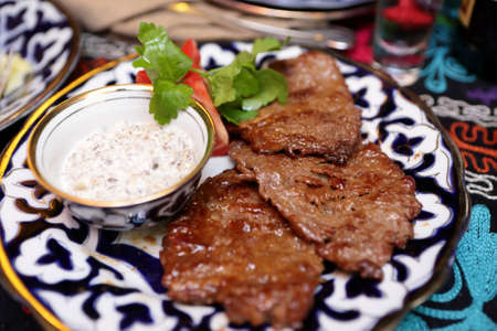 Plate with veal medallions in an uzbek restaurant