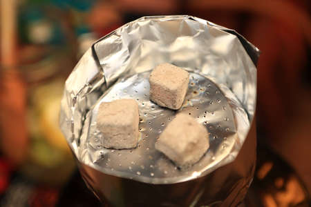 Details of hookah coals in an asian restaurant