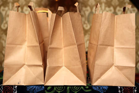 Three takeaway food packages on a table