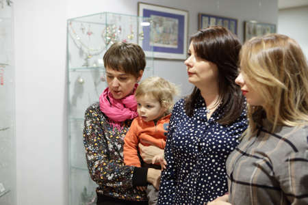 Portrait of women with boy in museumの写真素材