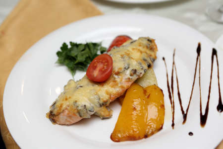 Plate with salmon steak in a restaurantの写真素材