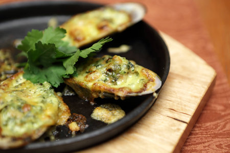 Baked mussels on plate in a restaurant