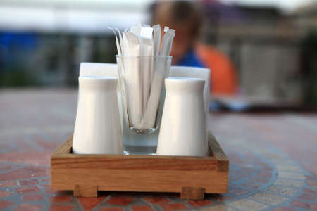Salt shaker and pepper on dining tableの写真素材