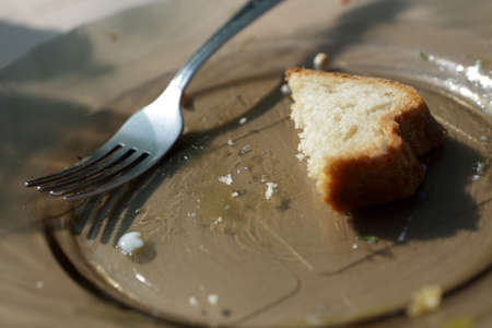Remains of bread on a plate in cafe