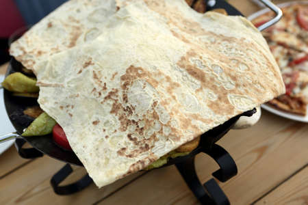 Lavash bread on Saj kebab in a restaurantの写真素材