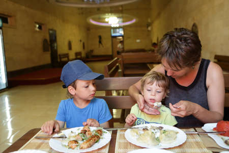 Family has lunch in an asian restaurantの写真素材