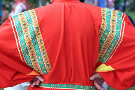 Man in red Russian national clothes. View from backの写真素材