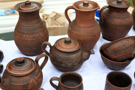 View of clay dishes on counter in a marketの写真素材