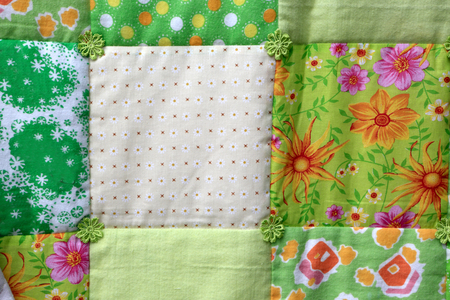 Details of a patchwork quilt as background