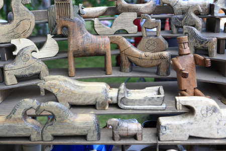 Wooden toys on counter in a marketの写真素材