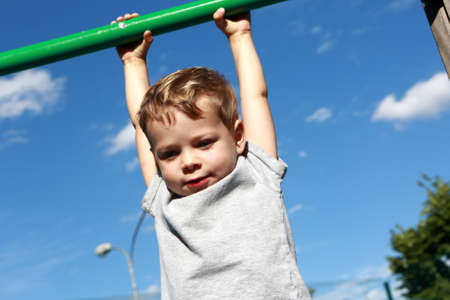 Portrait of a child on horizontal bar