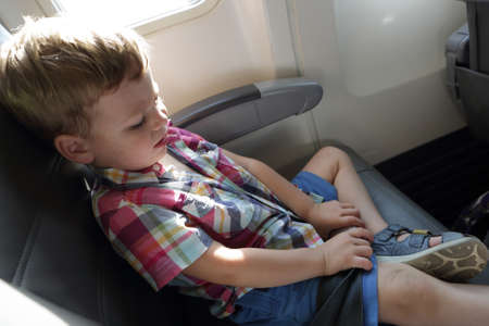 Portrait of a kid in an airplaneの写真素材