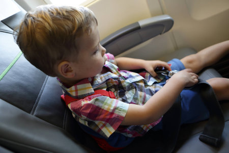 Portrait of a child in an airplaneの写真素材