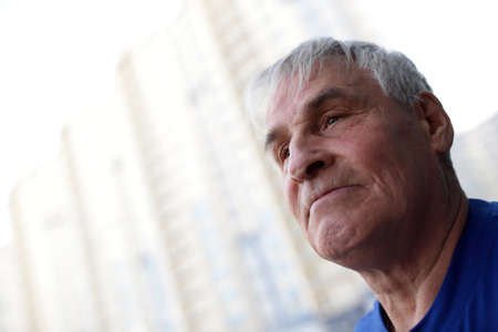 Portrait of senior man on building backgroundの写真素材