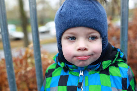 Portrait of a child in autumn parkの写真素材