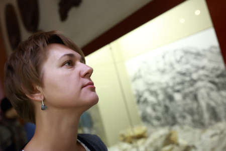 Portrait of a woman in a museumの写真素材