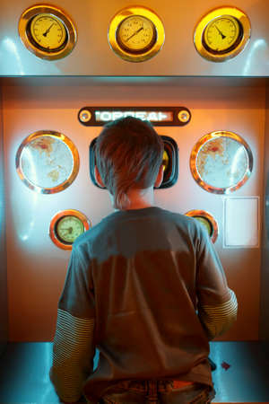 Child is fighting in sea battle at indoor playgroundの写真素材