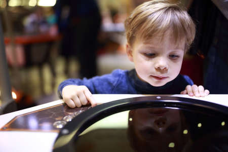 Kid doing a physical experiment in laboratoryの写真素材