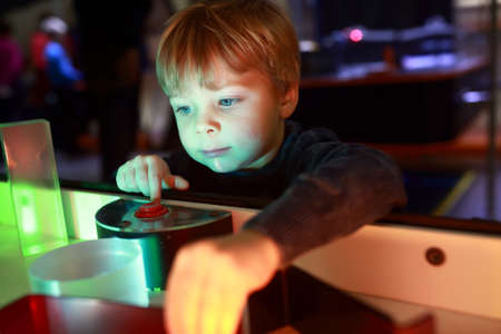 Child playing with refraction of light in lab