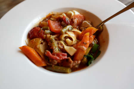 Plate with uzbek lamb and noodle soup in restaurantの写真素材