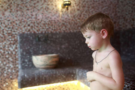 Portrait of a child in asian hammamの写真素材