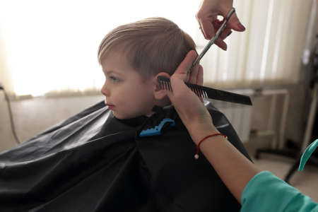 Portrait of a boy in hair salonの写真素材