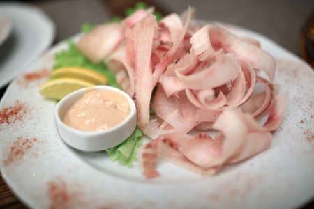 Stroganina made with muksun on a plateの写真素材