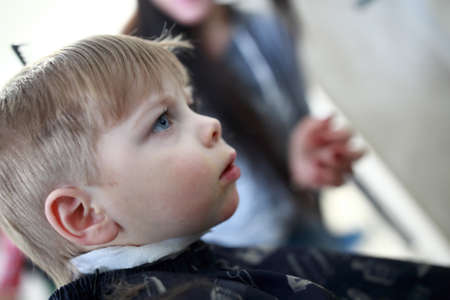 Portrait of a boy at the hairdresserの写真素材