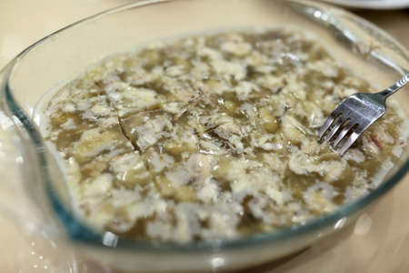 Plate with russian meat jelly dish on tableの写真素材