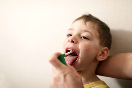 Treatment of a boy cold at homeの写真素材