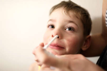 Treatment of a child cold at homeの写真素材