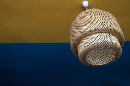 View of wooden lampshade on a ceilingの写真素材