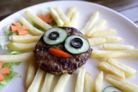 French fries with cutlet on a plate