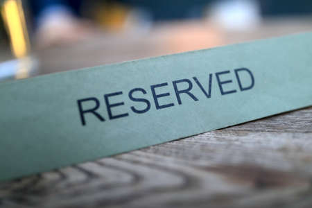 Sign reserved on table in a cafeの写真素材