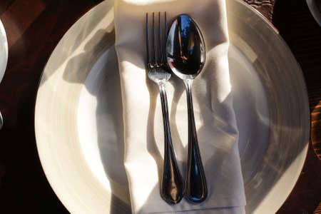 Fork with spoon on serviette in restaurant