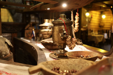 Russian samovar with bunch of bagels on tableの写真素材