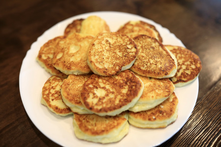 View of cottage cheese pancakes on white plate