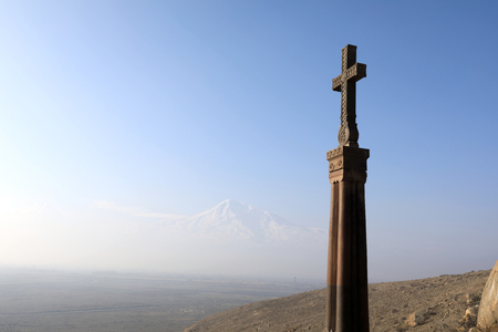 Stone cross in ararat valley in winter, Armenia