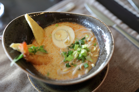Bowl of seafood soup on table in restaurantの写真素材