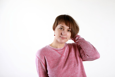 Portrait of woman on white wall backgroundの写真素材