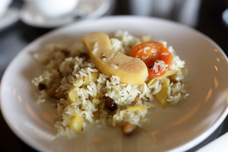 Pilaf with quince and dried apricots in asian restaurantの写真素材