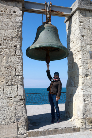 Woman and Chersonesus bell, Peninsula Crimea, Sevastopolの写真素材