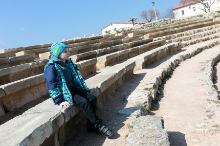 Child in ancient theater In Chersonesos, Crimean peninsulaの写真素材