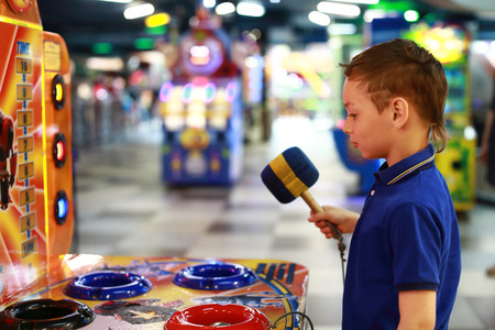 Portrait of boy playing in amusement parkの写真素材