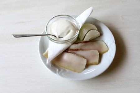 Chopped Lard with Onion and sour cream on plateの写真素材