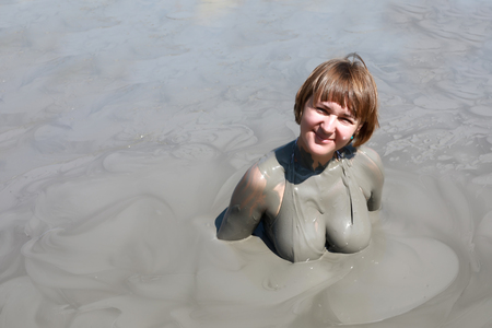 Portrait of woman in mud pool, Krasnodar region, Russia