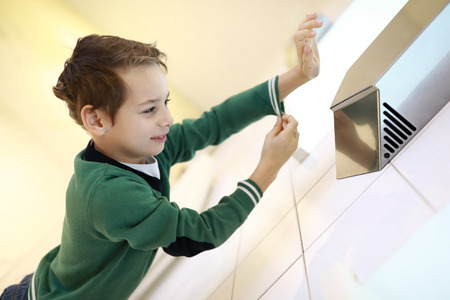Child dries his hand in the restroomの写真素材